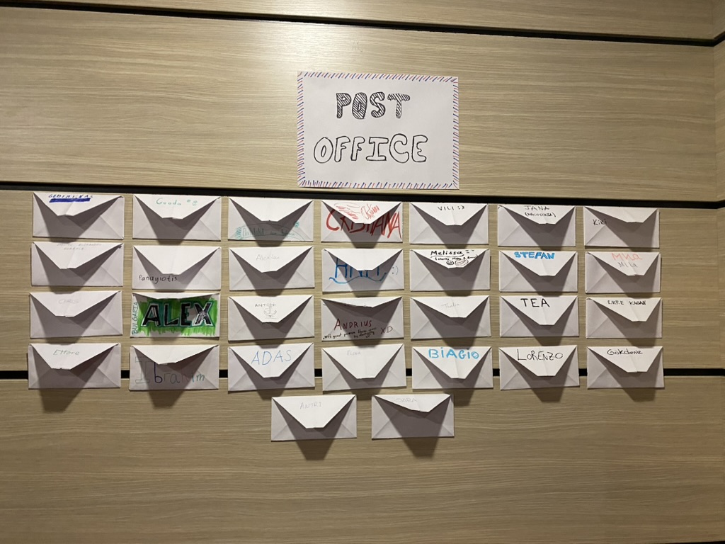 The Post Office wall with paper mailboxes for each participant